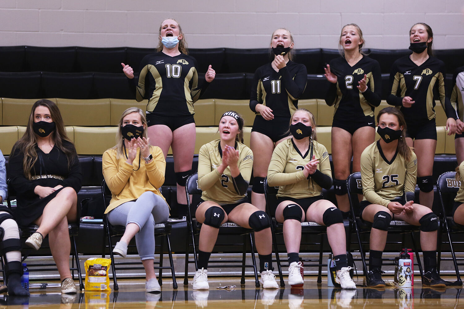 Buffalo’s varsity team stood behind the junior varsity bench to cheer them on